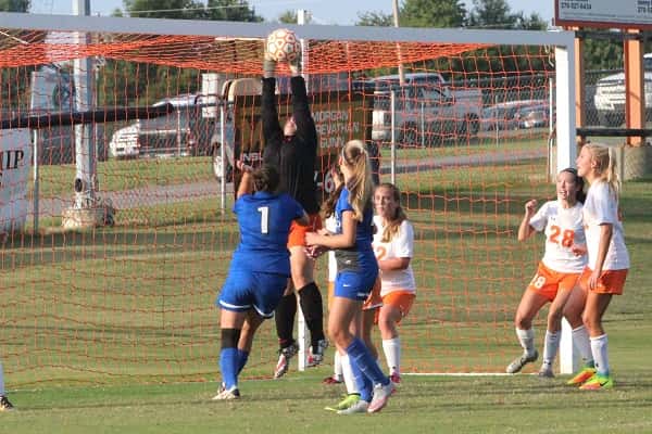 Lady Marshal goalkeeper Allie Fiske with one of her eight saves in Tuesday's game against Graves County.