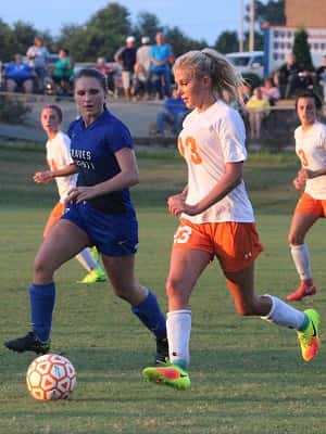 Midfielder Kylee Crass moving the ball for the Lady Marshals.