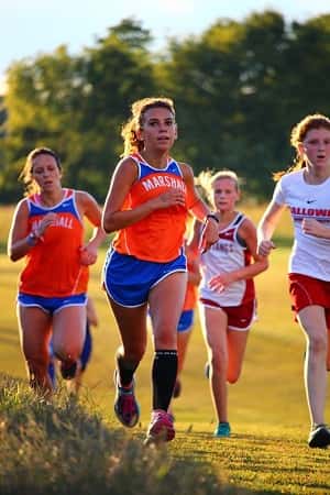 Haley Ford (right) and Chloe Kerrick (left) in the girl's varsity race. Photo courtesy of MCHS XC.