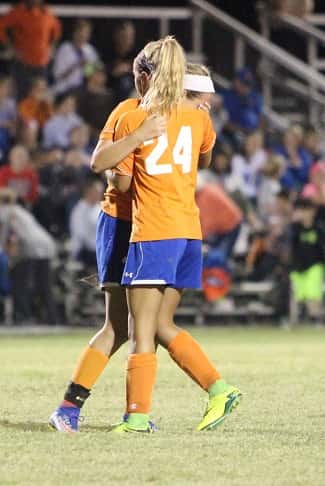 Camryn Crass (24) consoles senior Karmen Jackson after the Lady Eagles win in sudden death penalty kicks.