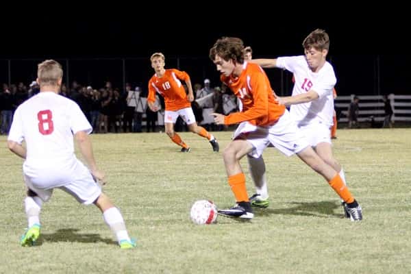 Caleb McNeely double teamed by Calloway's Christian Bobo (8) and Ty Stom (19), scored the Marshals only goal in their 2nd District semi-final loss.
