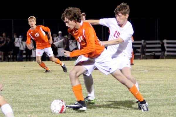 Caleb McNeely dribbling past Calloway's Ty Stom in last week's 2nd District Tournament game.