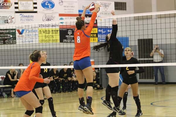 Paige Henson (8) timed this block perfectly against Murray in the Lady Marshals 3-0 district tournament semi-final win.