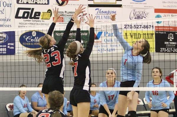 Abigail Cima (23) and Maggie Wagner (7) work together to block Calloway's Carson Mayes.
