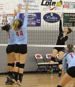 Emma Alexander (1) sent this hit sailing past Calloway blockers Chaney Hill (11) and Jacie Spann (44).