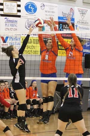 Emma Alexander (1) is met by Marshall County blockers Paige Henson (8) and Hannah Langhi (27).