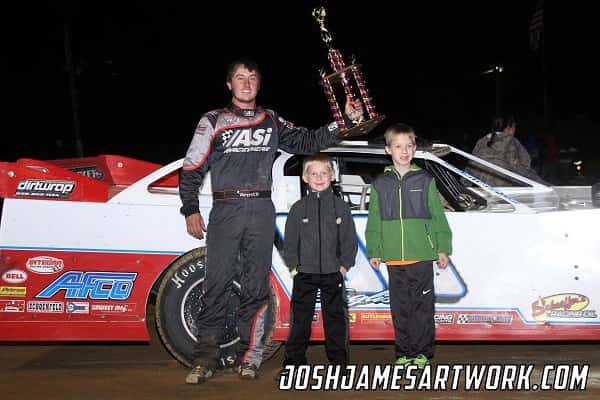 Tanner English celebrating in Victory Lane at Windy Hollow Speedway along with Ryder and Boston English.
