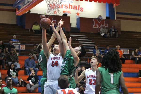 Ballard's Zane Parsons (34) and Erick Marinelli (14) doubled up on Houston Harvey (44).