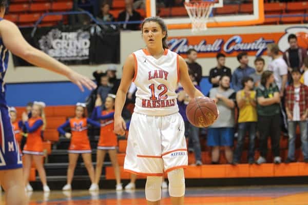 Tera Colson bringing the ball down the court for the Lady Marshals against Massac County.