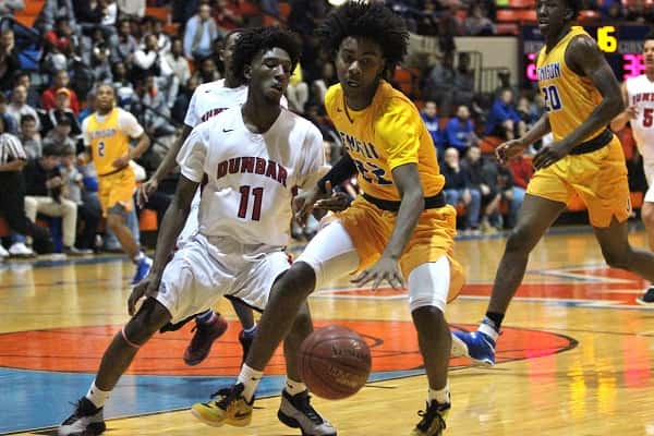 Dunbar's Taveion Hollingsworth (11) who has committed to WKU, guarding Jemison's Brandon Nicholas (22).