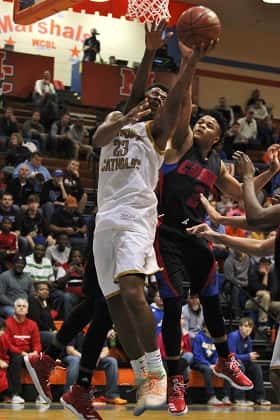 Currie's Elijah Joiner (2) attempts to block the shot of Althoff's Jordan Goodwin's (23) shot.