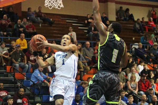 Hillcrest's Virshon Cotton (1) didn't back down against Prolific Prep big man Paul Scruggs (1).