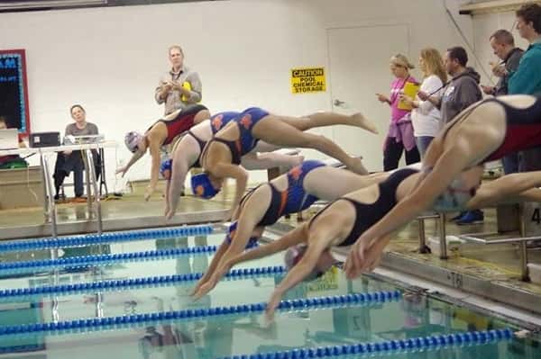 Marshall County girl's diving into the pool in an event at the Paducah Athletic Club pool.