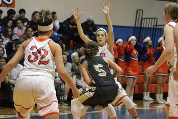 Lorin Powell stops the progress of Murray's Macey Turley in Tuesday's 4th District game against the Lady Tigers.