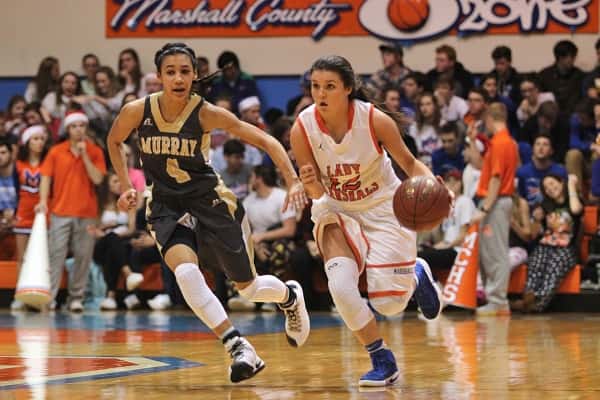 Murray's Alexandra Mayes (4) is step for step down the court with Lady Marshal Tera Coleson.