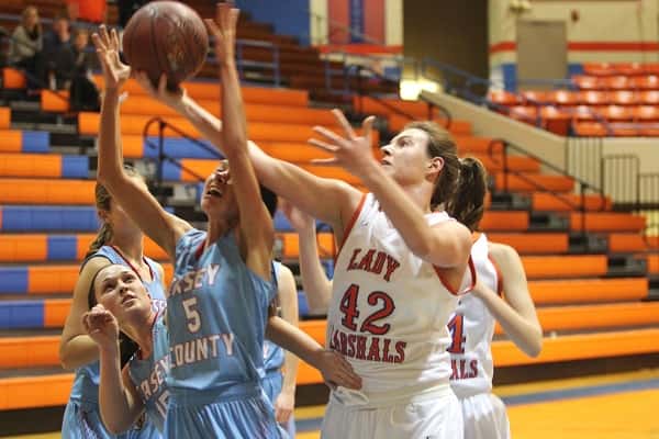 Hannah Langhi (42) maintains control of the ball against Casey County on her way to scoring 25 points in the Lady Marshals win.