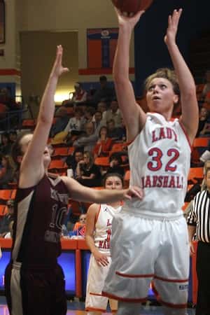 Paige Henson (32) shooting over the out-stretched hand of Webster County's Kelsey Payne.