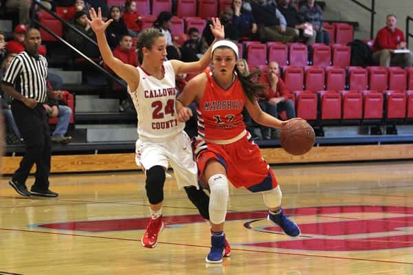 Calloway's Keeli Puckett (24) sticks close to Tera Colson in the Lady Marshals 54-30 win over the Lady Lakers.