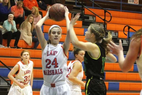 Lorin Powell (24) set the scoreboard on fire with a career high 31 points in the Lady Marshals 77-58 win.