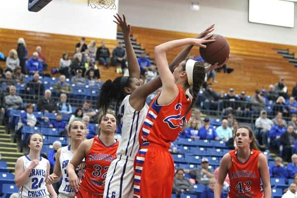 Graves County's Zippora Johnson gets a hand on the ball on this shot by Lorin Powell. Powell had 7 points and 7 rebounds against Graves County.