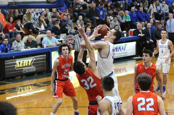 Graves County's 7' senior Chris Vogt taking a shot over Matt French (32) in the Marshals loss to the Eagle Friday at Graves County.