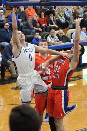 Ryan Mathis (11) led Graves County with 25 points and hit 7 three's to lead the Eagles over the Marshals.