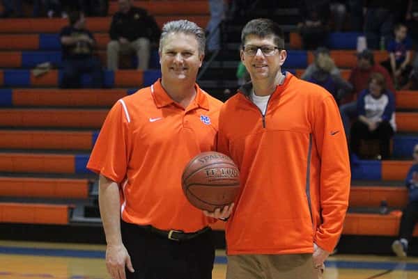 Marshall County Athletic Director Jeff Stokes, presented Marshals Head Coach Gus Gillespie with the game ball in honor of his 400th career win as a head coach.