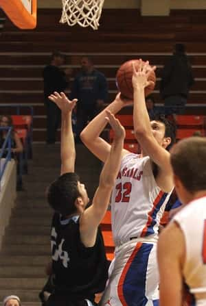 Matt French shoots over Muhlenberg's Will Nofsinger in the Marshals 54-50 win.