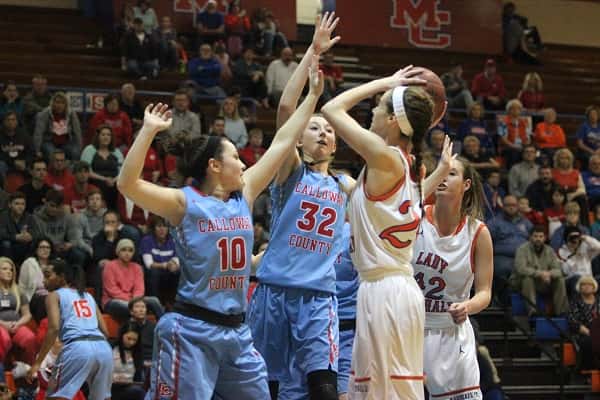 Lorin Powell shoots over Calloway's Megan Greer (10) and Charlee Settle (32).
