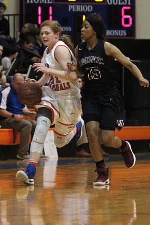 Miyah Davis, guarded by Jayda Civils, led the Lady Marshals in their win over Madisonville-North Hopkins with 23 points.