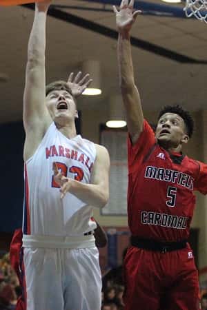 Tyler Stokes, against Mayfield's Anton Lumson, lays in this basket for two of his six points in the Marshals win.