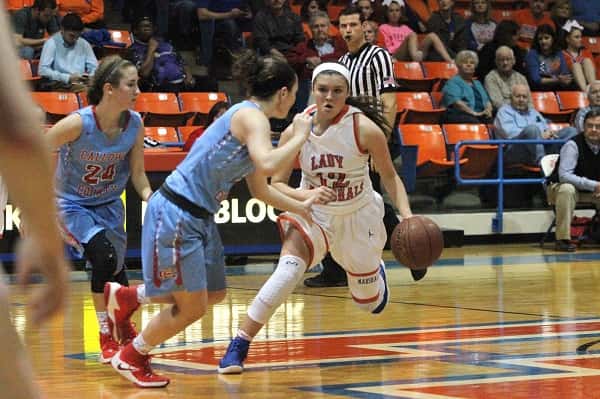 Tera Colson, defended by Calloway's Megan Greer, bringing the ball down court for the Lady Marshals.