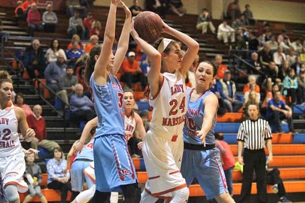 Lorin Powell (24), double teamed by Calloway's Charlee Settle (32) and Megan Greer (10) in Tuesday's 4th District semi-final.