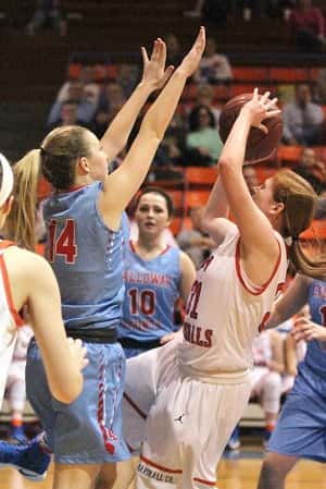 Miyah Davis gets a shot off against Calloway's Allie Fritts (14) on her way to 15 points in the Lady Marshals win.