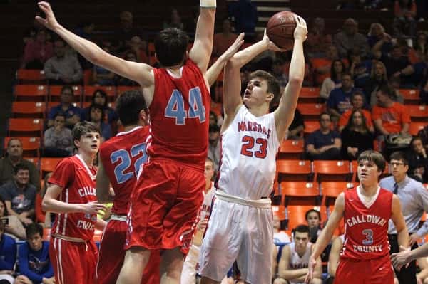 Tyler Stokes shoots over Calloway's Payton Johnson (44) in Thursday's 4th District Tournament Championship game.