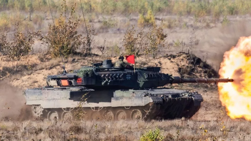 Pabrade Lithuania A Leopard 2A7 main battle tank is captured in action^ firing its main cannon during a live-fire exercise. 10-13 - 2020
