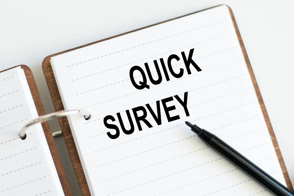 quicksurveytextwrittenonanotepadwithblackmarker