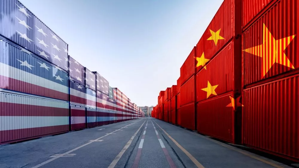 Metaphor image of United States of America and China trade war tariffs as two opposing container cargo and airplane over the port as an economic taxation dispute over import and exports concept