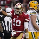 NFC Championship Packers 49ers Football: San Francisco 49ers quarterback Jimmy Garoppolo (10) celebrates after converting a first down against the Green Bay Packers during the first half of the NFL NFC Championship football game Sunday, Jan. 19, 2020, in Santa Clara, Calif. (AP Photo/Tony Avelar)
