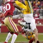 APTOPIX NFC Championship Packers 49ers Football: Green Bay Packers wide receiver Allen Lazard (13) falls to the ground between San Francisco 49ers free safety Jimmie Ward (20) and Emmanuel Moseley during the first half of the NFL NFC Championship football game Sunday, Jan. 19, 2020, in Santa Clara, Calif. (AP Photo/Tony Avelar)