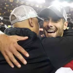 APTOPIX NFC Championship Packers 49ers Football: San Francisco 49ers quarterback Jimmy Garoppolo, right, celebrates with assistant coach Miles Austin after the NFL NFC Championship football game against the Green Bay Packers Sunday, Jan. 19, 2020, in Santa Clara, Calif. The 49ers won 37-20 to advance to Super Bowl 54 against the Kansas City Chiefs. (AP Photo/Tony Avelar)