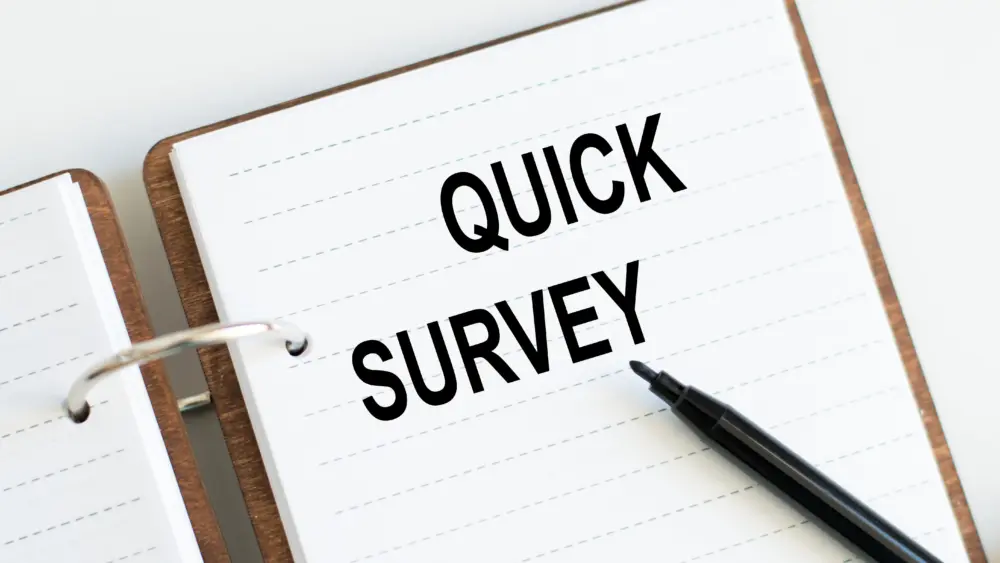 quicksurveytextwrittenonanotepadwithblackmarker