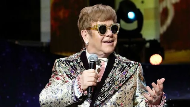 m_eltonjohnseatedsmiling_030518