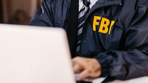 fbi-detective-using-laptop-in-his-office