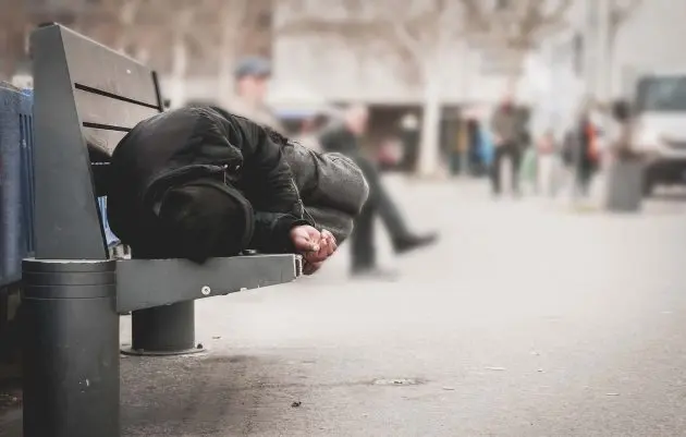 homeless-man-on-bench-e1545060163748