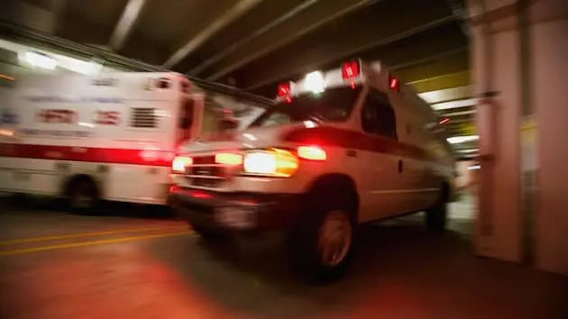 ambulance-pulling-away-from-hospital-blurred-motion