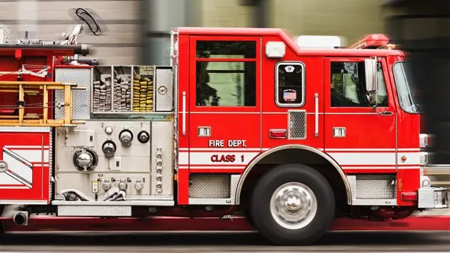 blurred-view-of-fire-truck-driving-in-city