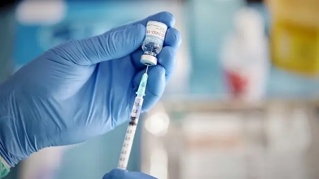 a-healthcare-worker-prepares-a-dose-of-covid-19-vaccine
