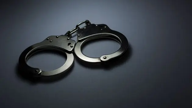 close-up-of-handcuffs-over-gray-background-2