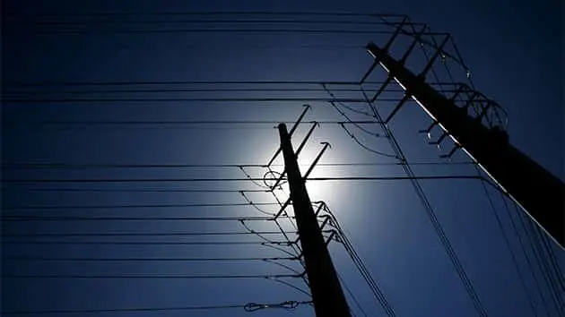 maze-of-power-lines-against-deep-blue-sky
